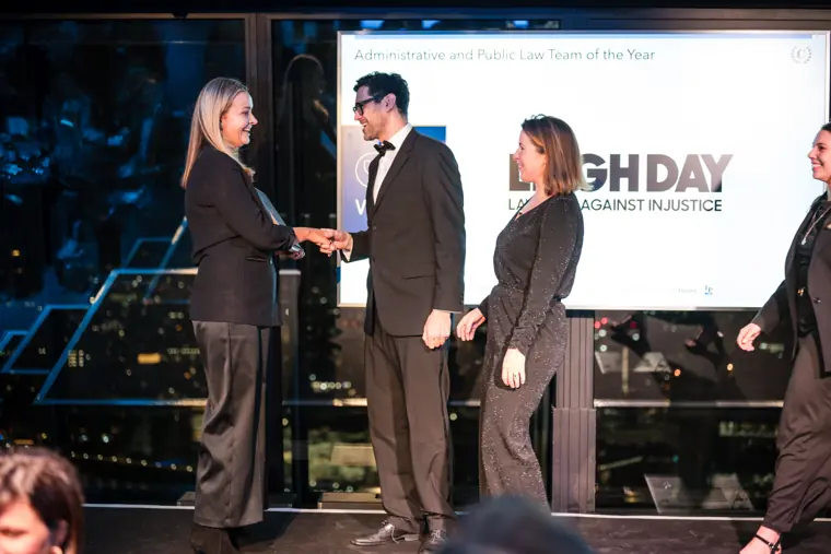 An award being handed to a recipient.