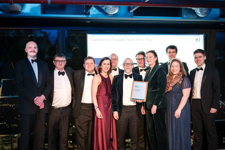 A group of winners with their certificate.