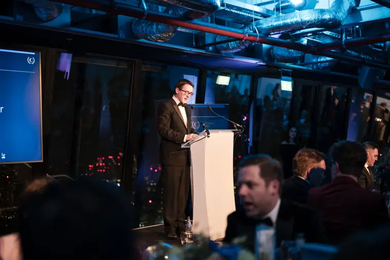The presenter speaking to the awards audience.
