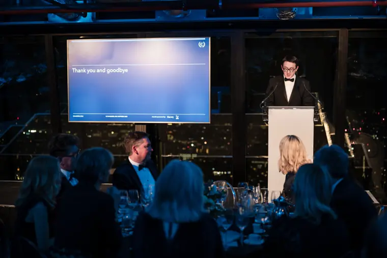 The awards presenter announcing the next category.