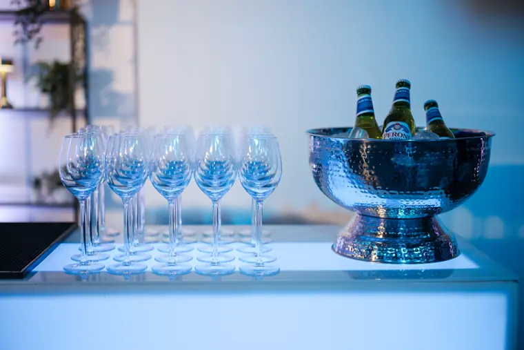 Glasses arranged at the welcome bar.