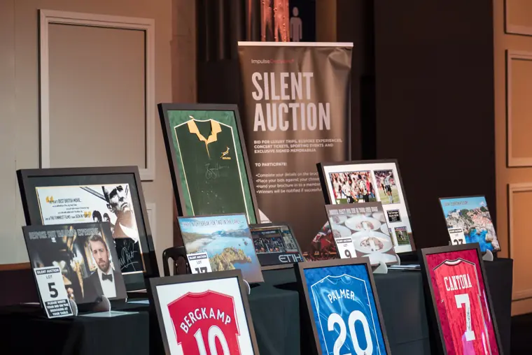 Silent auction items displayed before the ceremony.