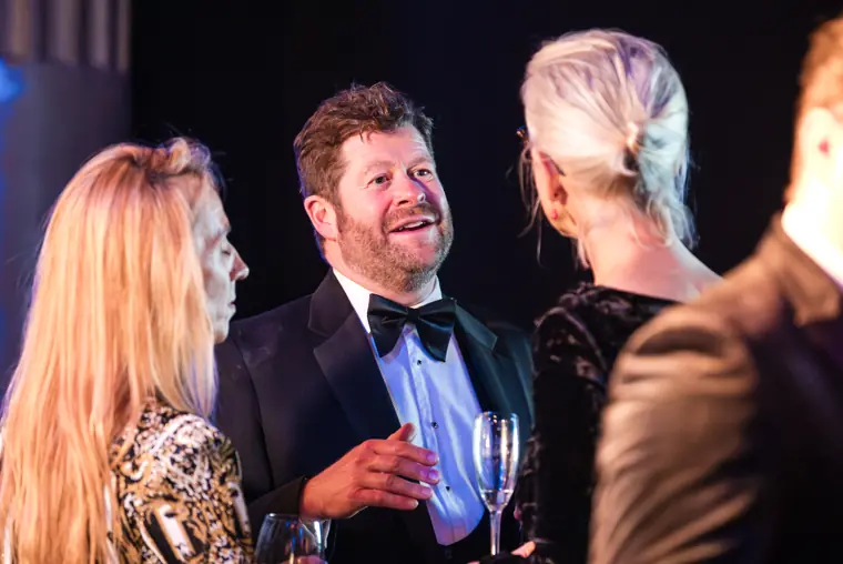 Guests chatting during the drinks reception.