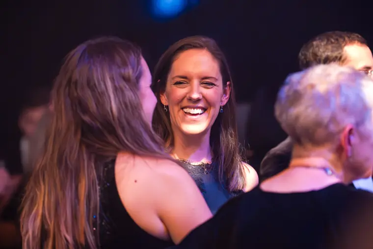 A guest smiling during a conversation.