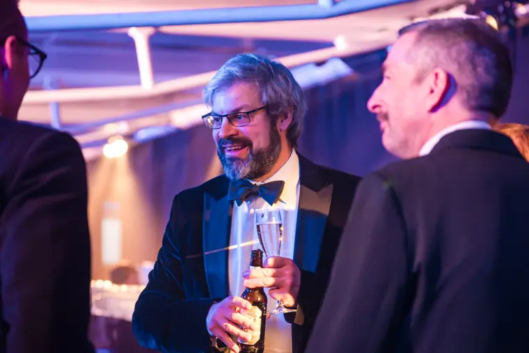Two guests chatting during the welcome reception.