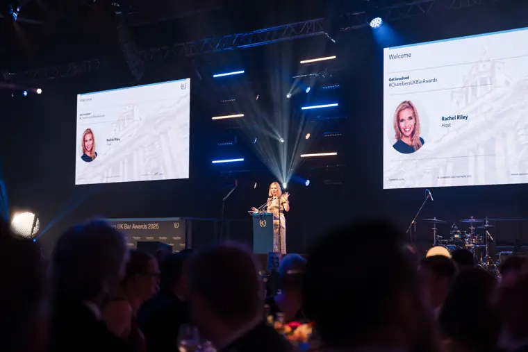The nominee screen and speaker during the awards.