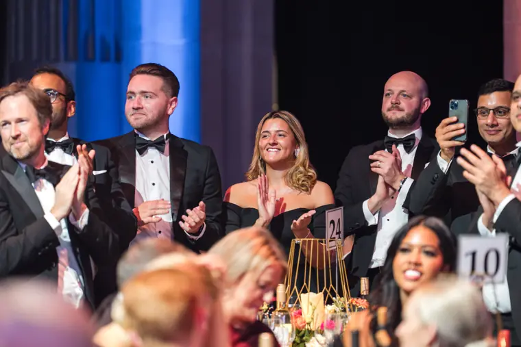 Guests applauding a winner from their table.