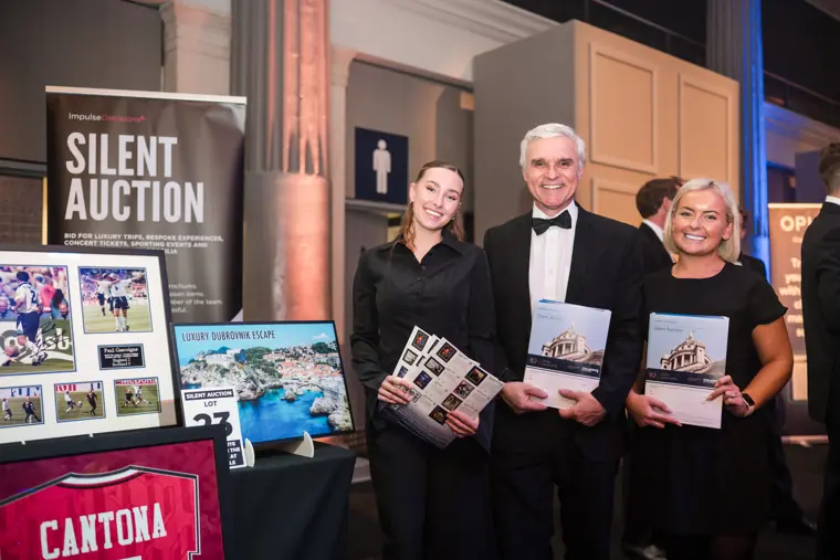 Guests at the silent auction display.