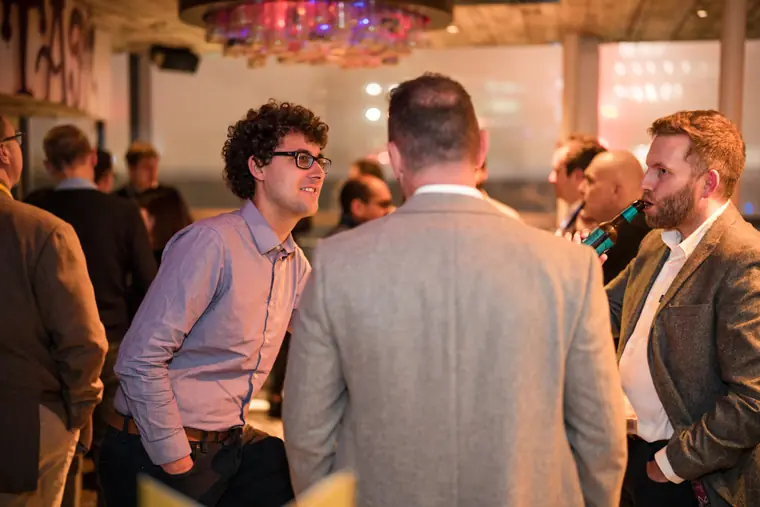 Delegates networking at the reception.