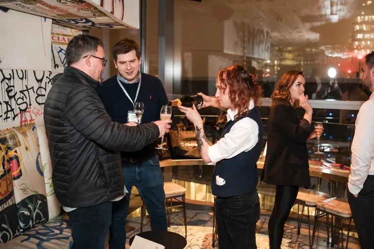 Guests connecting at the ClickUp evening reception.