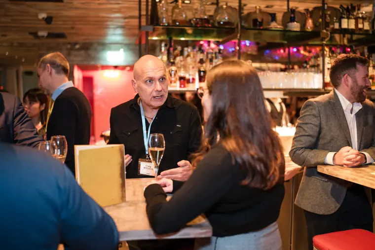 Guests connecting at the ClickUp evening reception.