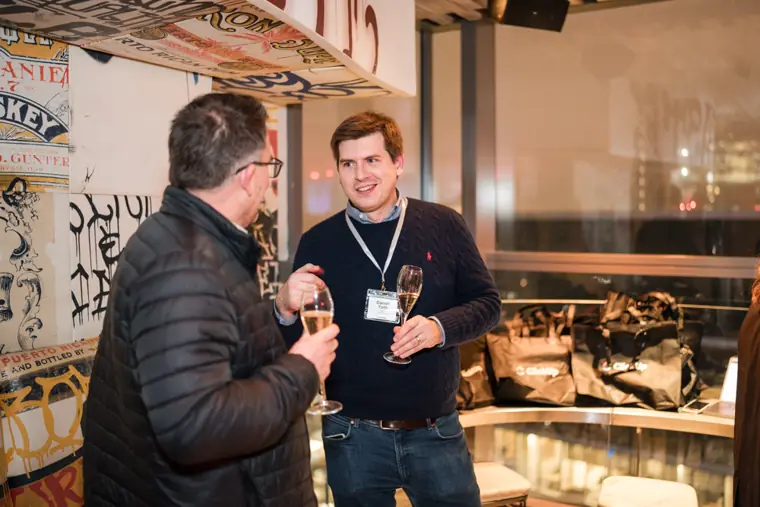 Guests connecting at the ClickUp evening reception.