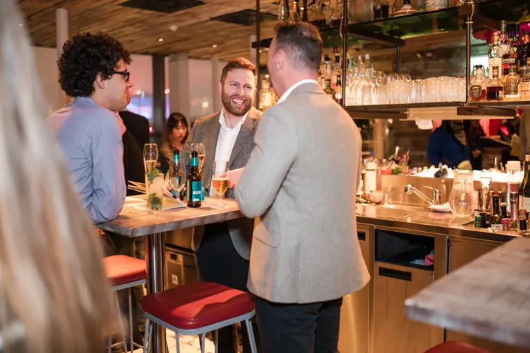 Guests connecting at the ClickUp evening reception.