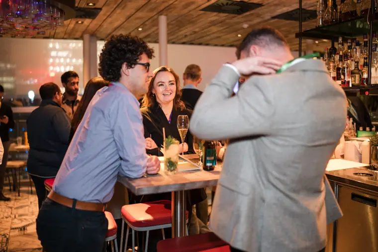 Guests connecting at the ClickUp evening reception.