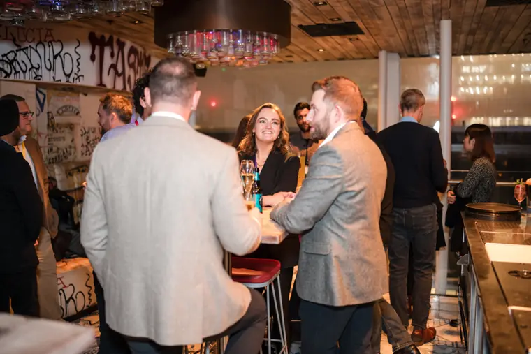 Guests connecting at the ClickUp evening reception.