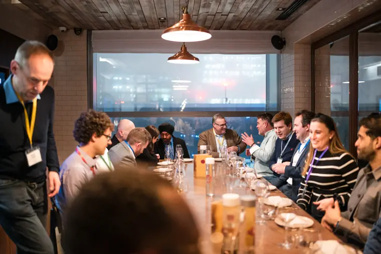 Client dinner guests around the table.