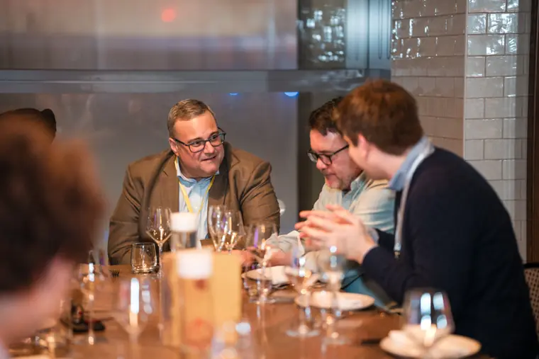 Guests and speakers at the ClickUp client dinner.