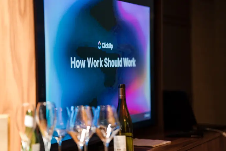 ClickUp presentation displayed at dinner.