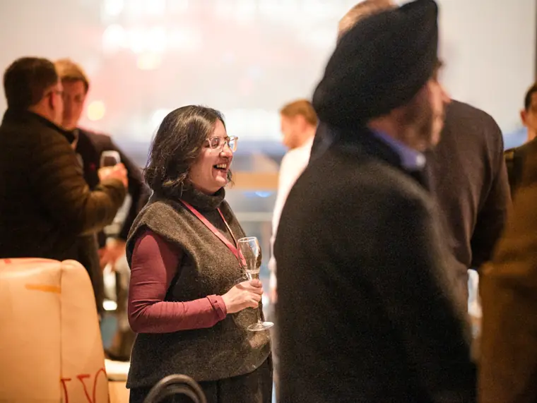 Guests networking during the ClickUp event.