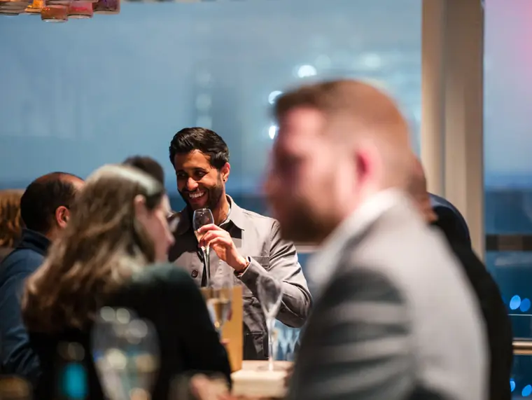 Guests networking during the ClickUp event.