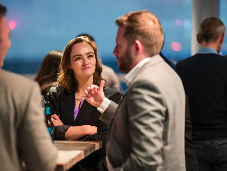 Guests in conversation at the reception.