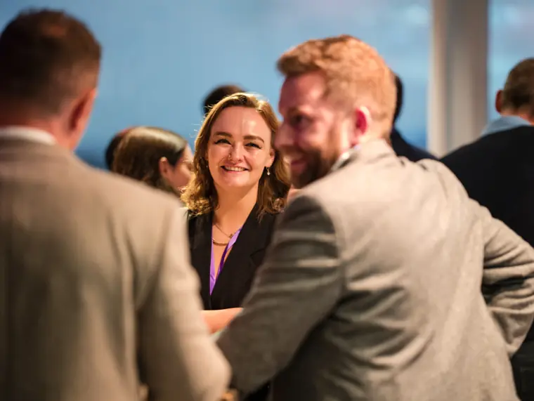 Guests networking during the ClickUp event.