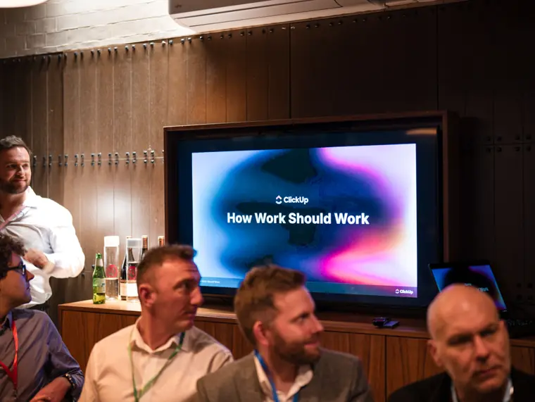 Presentation and audience at the client dinner.
