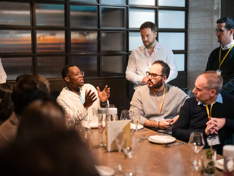 Conversation around the ClickUp dinner table.