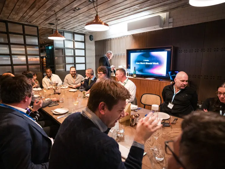 Dinner guests following the conversation.