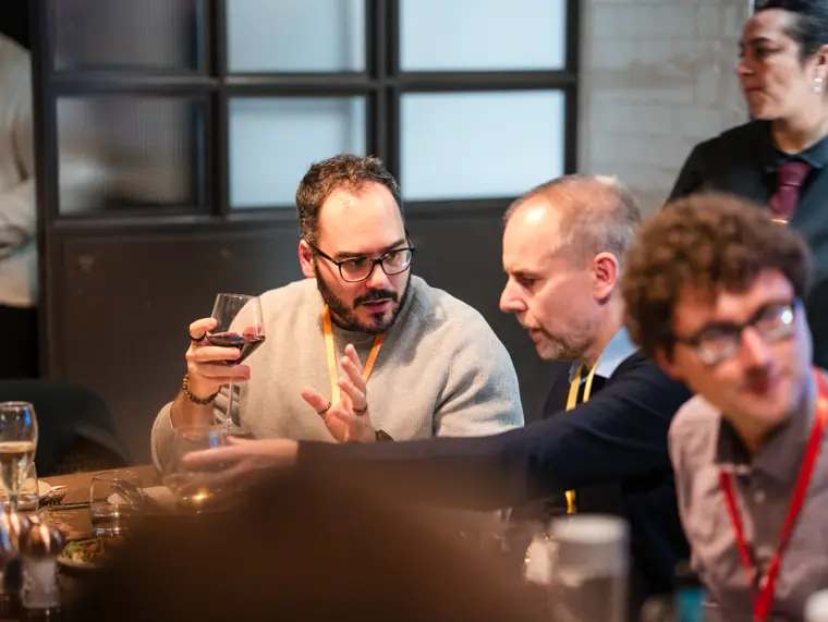 Conversation around the ClickUp dinner table.
