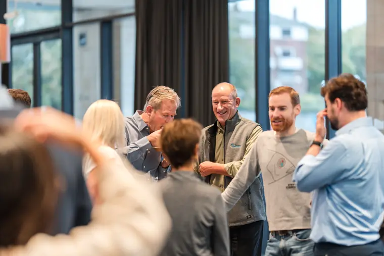 Guests connecting at the investor meeting.