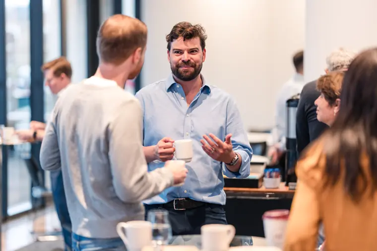 Guests connecting at the investor meeting.
