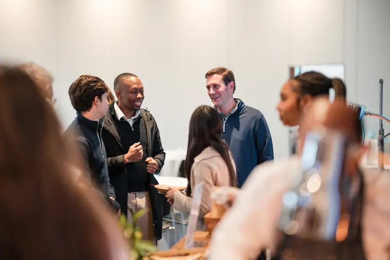 Guests connecting at the investor meeting.