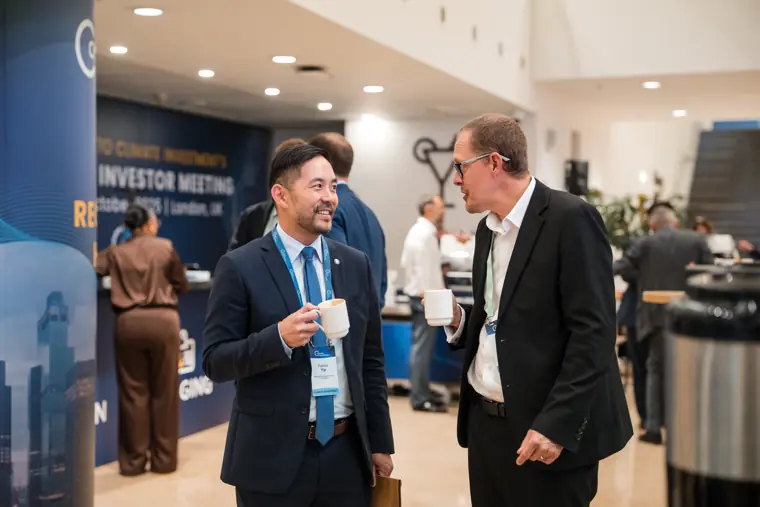 Guests connecting at the investor meeting.