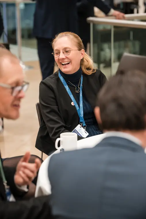 Guests connecting at the investor meeting.