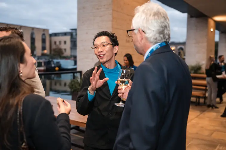 Guests connecting at the investor meeting.