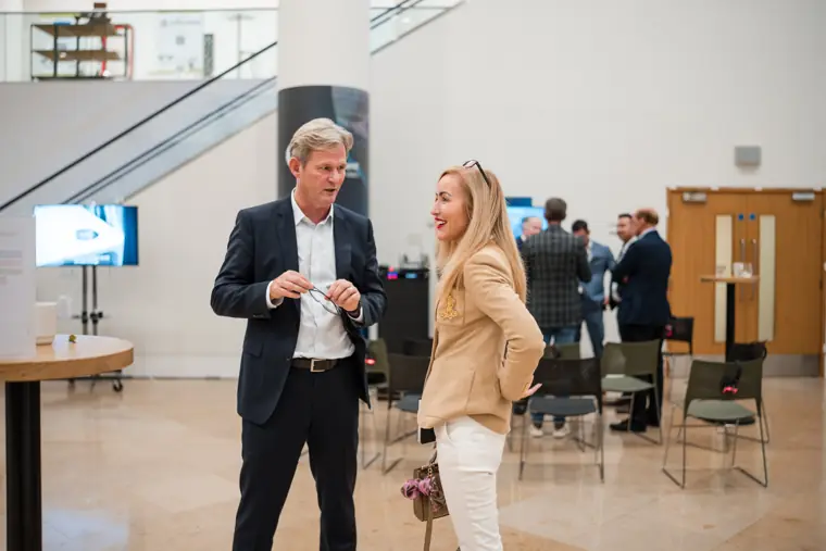 Guests connecting at the investor meeting.