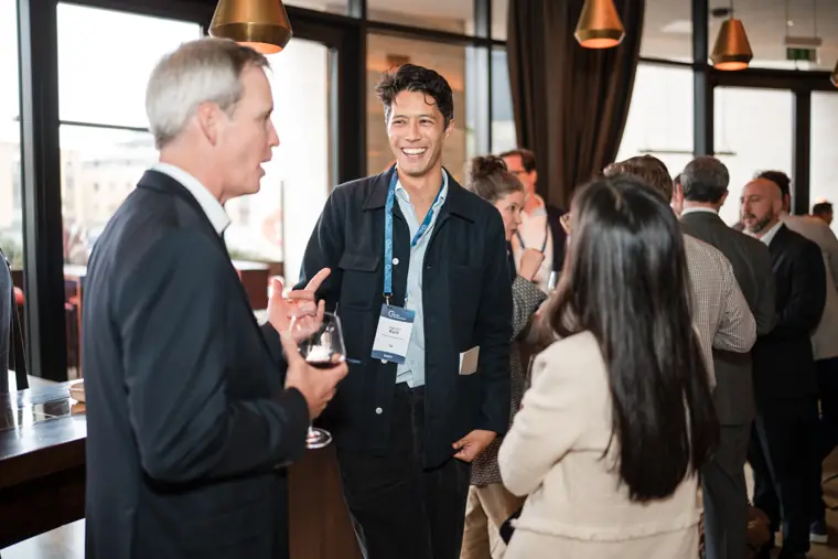 Guests connecting at the investor meeting.
