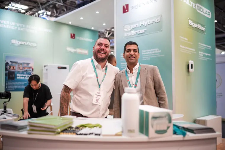 Two Fáilte Solar team members at the exhibition counter.