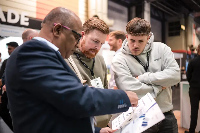Visitors looking over the product information.