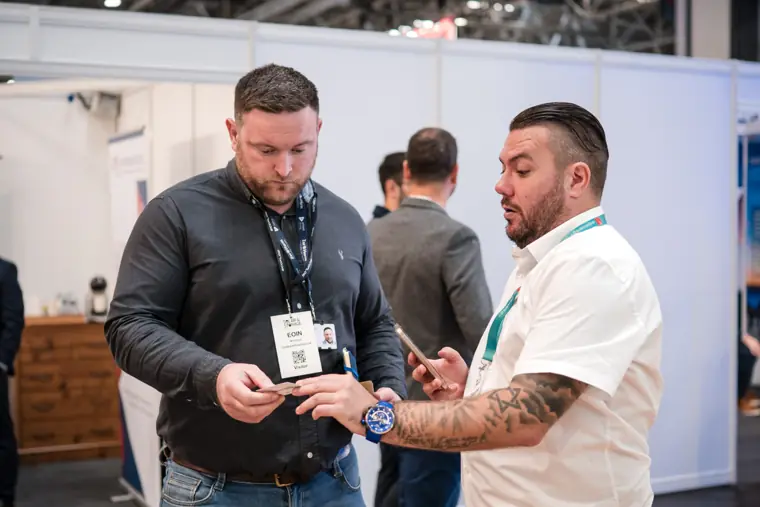 A team member explaining the materials at the counter.