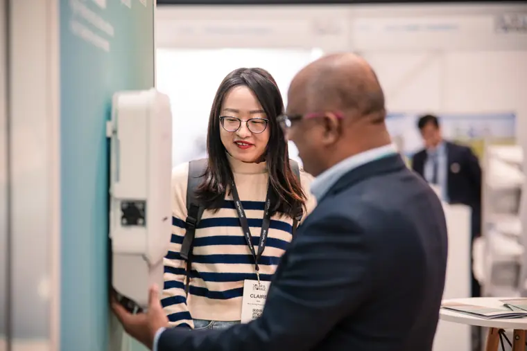 A close conversation beside the product display.