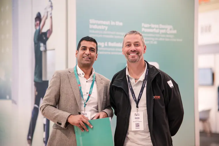 A Fáilte Solar team member with an exhibition visitor.