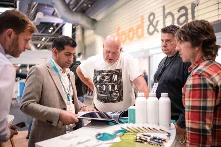 A group reviewing materials at the counter.
