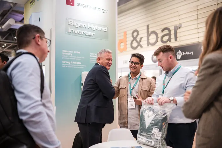 A conversation at the exhibition counter.