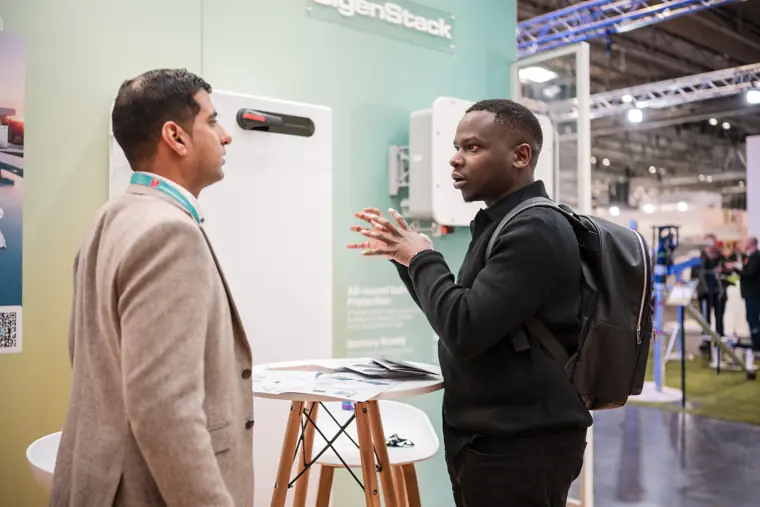 A visitor speaking with a Fáilte Solar representative.