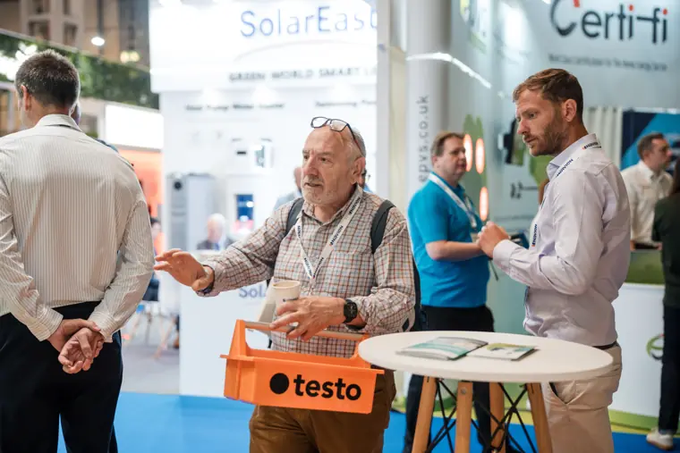 Visitors discuss solar products at the Fáilte Solar stand.