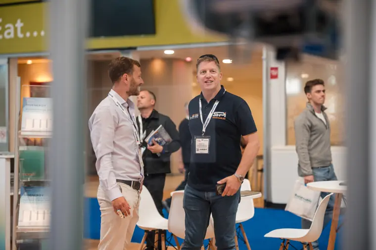 Visitors talk with a Fáilte Solar representative.