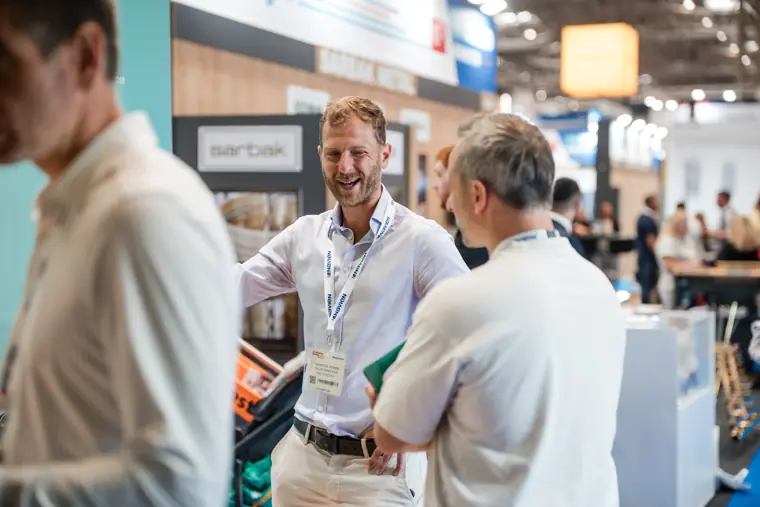 A group discusses the technology at InstallerSHOW.