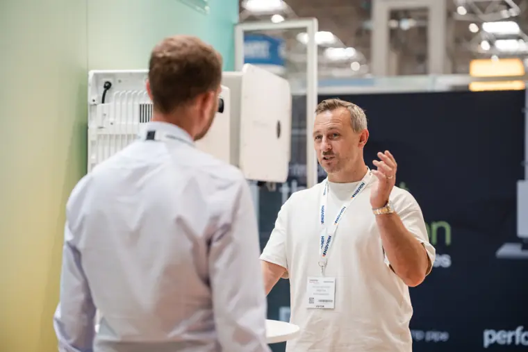 A visitor asks a question in the demonstration area.